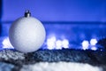 White Christmas Ball in Blue Ambient Light Royalty Free Stock Photo