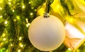 White christmas ball on a christmas tree