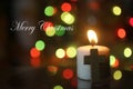 White Christmas candle light with colorful bokeh light and Jesus Christ holy cross crucifix. Merry Christmas card and greeting Royalty Free Stock Photo