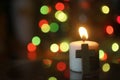 White Christmas candle light with colorful bokeh light and Jesus Christ holy cross crucifix. Royalty Free Stock Photo