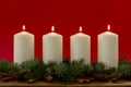 White christmas candles on red background, Advent. 4 burning candles Royalty Free Stock Photo