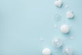 White Christmas decorations on mint pastel background. Christmas or New year holiday card top view. Minimalistic flat lay