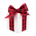 White Christmas gift box with black and red buffalo plaid bow and ribbon isolated on white Royalty Free Stock Photo