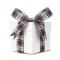 White Christmas gift box with green, red and white plaid bow and ribbon isolated on white Royalty Free Stock Photo