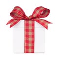 White Christmas gift box with red and brown gingham plaid bow and ribbon isolated on white