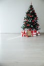 White Christmas home interior Christmas tree red gifts new year decor festive background Royalty Free Stock Photo