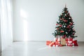 White Christmas home interior Christmas tree red gifts new year decor festive background Royalty Free Stock Photo