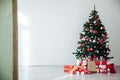 White Christmas home interior Christmas tree red gifts new year decor festive background Royalty Free Stock Photo