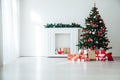 White Christmas home interior Christmas tree red gifts new year decor festive background Royalty Free Stock Photo