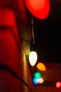 A string of Christmas lights on the exterior of a home on a December night. Royalty Free Stock Photo