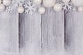 White Christmas ornament top border with snow on white wood Royalty Free Stock Photo