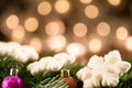 White Christmas snowflakes background defocused yellow lights. Royalty Free Stock Photo
