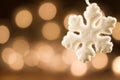 White Christmas snowflakes background defocused yellow lights. Royalty Free Stock Photo