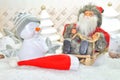 White Christmas - Snowman ans claus with winter snow background Royalty Free Stock Photo