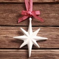 White Christmas star ornament on rustic wood Royalty Free Stock Photo