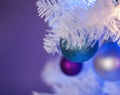 White Christmas tree with blue lights, white lights, turquoise ornament in front Royalty Free Stock Photo