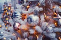 White Christmas tree decorated with bauble toys and yellow balls. Preparing to celebrate the new year and christmas Royalty Free Stock Photo