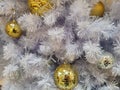 White Christmas tree decoration disco and golden ball ornaments with white tinsel Royalty Free Stock Photo