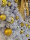 White Christmas tree decoration ornaments and hanging disco and golden ball with silver tinsel background Royalty Free Stock Photo