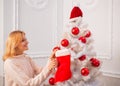 White christmas tree red balls. Christmas stockings. Home Christmas atmosphere. Winter holidays and people concept. Royalty Free Stock Photo