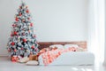 White Christmas tree with red bedroom toys new year winter gifts decor Royalty Free Stock Photo