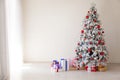 White Christmas tree with red toys new year winter gifts decor