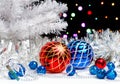 White christmas tree standing in the sparkling tinsel with christmas decorations on dark background with blurred lights Royalty Free Stock Photo