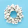 White christmas wreath with decoration on a light blue background. Flat lay Royalty Free Stock Photo