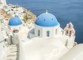 White Church with bells and blue dome at Oia, Santorini, Greek Islands Royalty Free Stock Photo