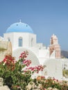 White Church with bells and blue dome at Oia, Santorini, Greek Islands Royalty Free Stock Photo