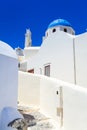 White church with blue dome in Oia town on Santorini island, Greece Royalty Free Stock Photo