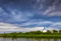 White church with blue domes under a stormy sky Royalty Free Stock Photo