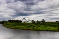 White church with blue domes under a stormy sky. Royalty Free Stock Photo