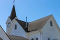 White church building against turquoise blue sky