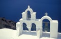 White church with clocktowers in Oia on volcanic island of Santorini