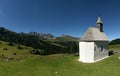 White church in hillside, Alpi di Siusi, Dolomites, Italy