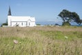 White church with horses.