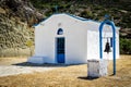 White church with iron bell in mountains of crete island, Greece Royalty Free Stock Photo