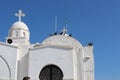 The white Church on Lycabettus hill with birds on the roof