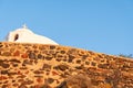 A white church on a mountain peak in santorini island Royalty Free Stock Photo
