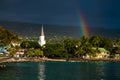 White church and rainbow over the city of Kailua Kona