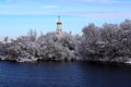 White Church on river in winter, trees covered with ice and snow. Winter landscape, Christian church Royalty Free Stock Photo