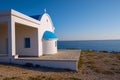 White church on the rocky shore of the cape Greco. Wide angle Royalty Free Stock Photo