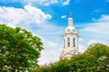 White church spire on blue cloudy background Royalty Free Stock Photo