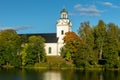 White church surrounded by lush autumn trees Royalty Free Stock Photo