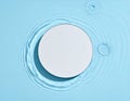 White Circle in Blue Water Ripples Background Royalty Free Stock Photo
