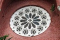 White Circle Mortar flower pattern with Stained Glass and red brick of exterior of church gable at cathedral of the holy trinity.