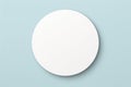 White circular blank paper mockup on a light blue background with copy space