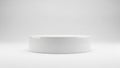 A white, circular, minimalist podium on a plain white background for product display Royalty Free Stock Photo