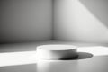 White circular podium in a sunroom. An empty, simple podium for product presentation in the sunlight